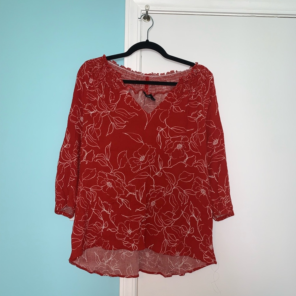 red and white floral blouse